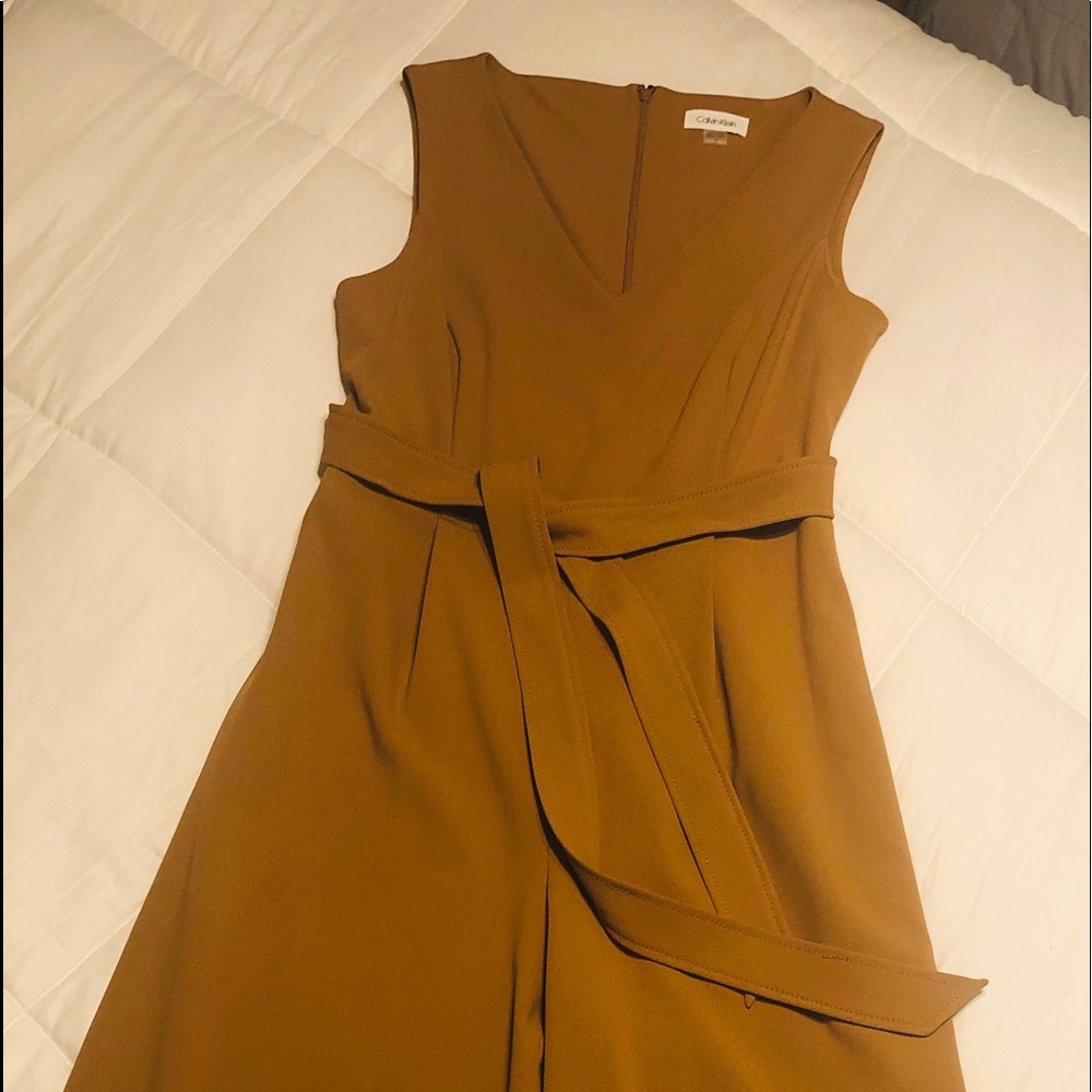 Calvin Klein Sleeveless Jumpsuit. Size 12. Great Gold Color. Never Worn!
